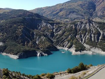 High angle view of sea and mountains against sky