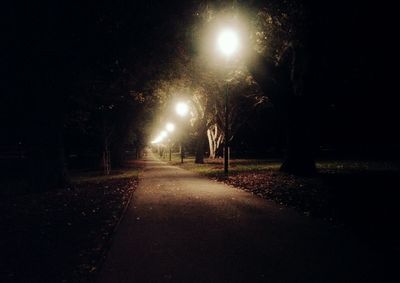 View of illuminated street at night