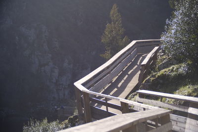 High angle view of wood foot bridge in forest