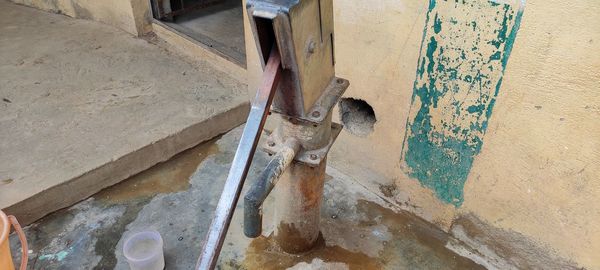 High angle view of rusty metal on wall