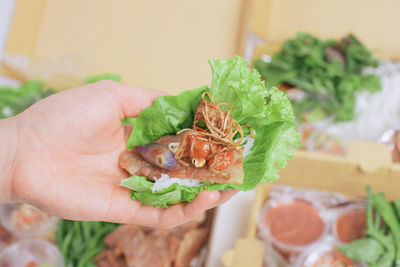 Close-up of hand holding food