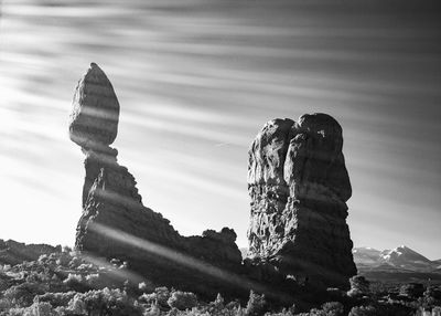 Low angle view of rock formations against sky