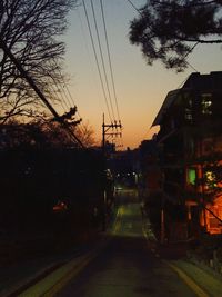 Road along buildings at sunset