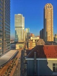 Modern buildings in city against clear sky