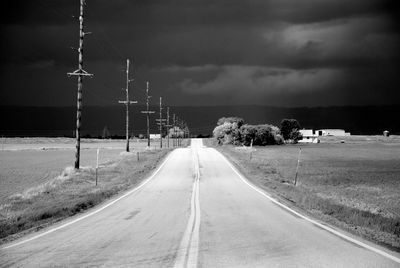 Road amidst landscape against sky