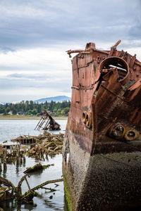 Old rusty ship against sky