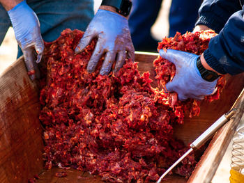 People working on barbecue grill