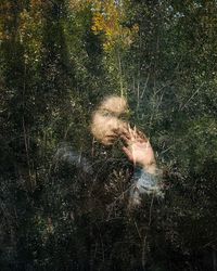 Man holding umbrella on field during rainy season