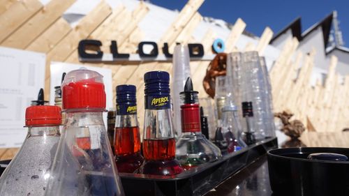 Close-up of wine bottles on glass