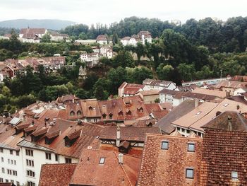 Houses in town against sky