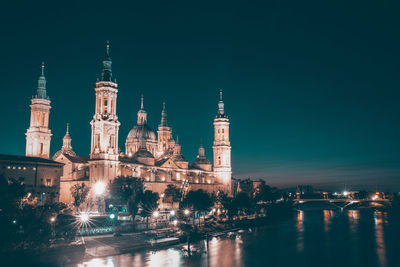 Illuminated buildings in city at night