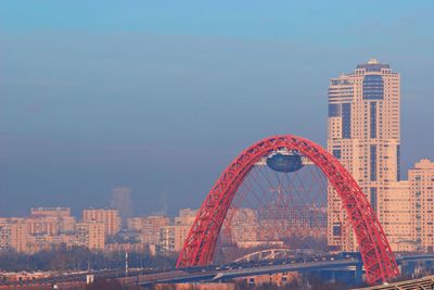 Low angle view of buildings against cloudy sky