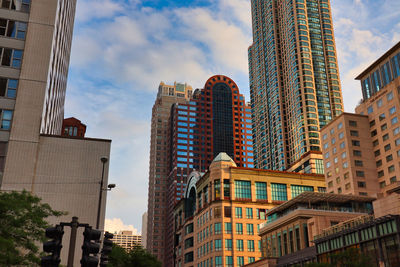 Low angle view of buildings in city against sky