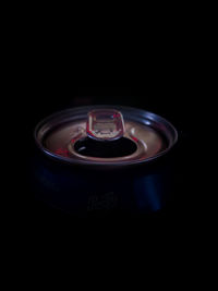 Close-up of candle against black background