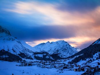 Scenic view of snow covered mountains against sky