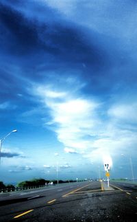 Road against cloudy sky