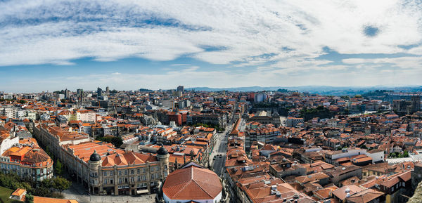 High angle view of city against cloudy sky