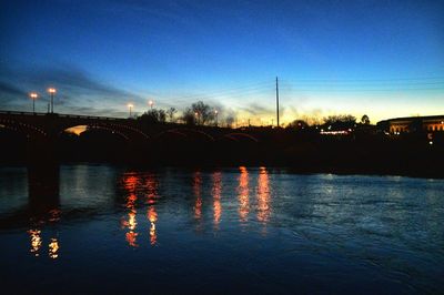 Reflection of trees in water at night