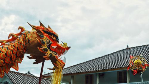 Low angle view of statue against sky