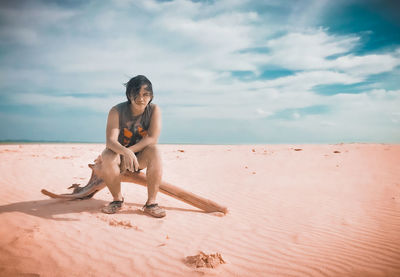 Full length of man on beach against sky