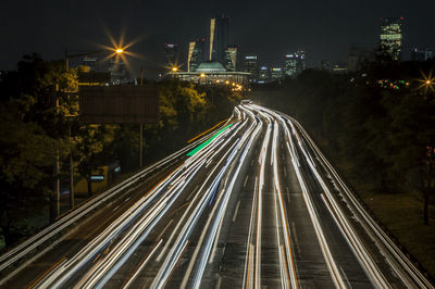 Light trails on street in city at night