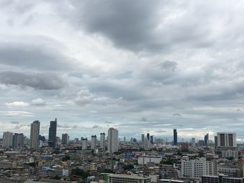 Modern buildings in city against sky