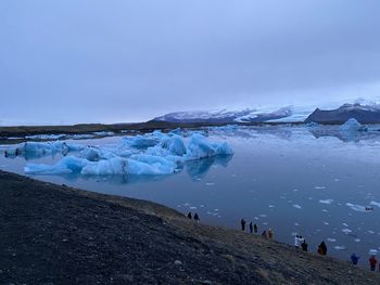 Scenic view of frozen lake against sky