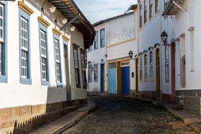 Street amidst buildings against sky