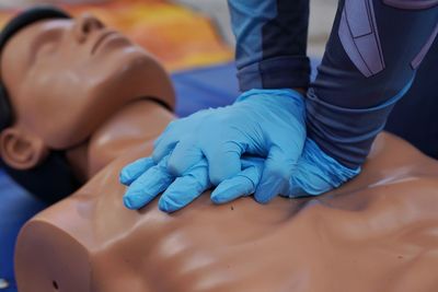 Midsection of woman holding hands