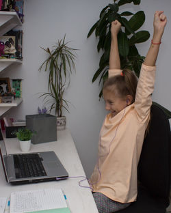 Full length of boy wearing hat at home