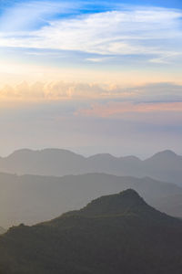 Scenic view of mountains against sky during sunset