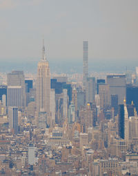 Modern buildings in city against sky