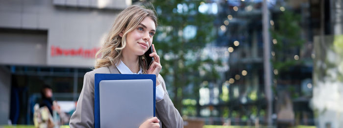 Young woman using digital tablet