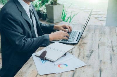 Man using laptop on table