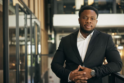 Portrait of businessman standing in office