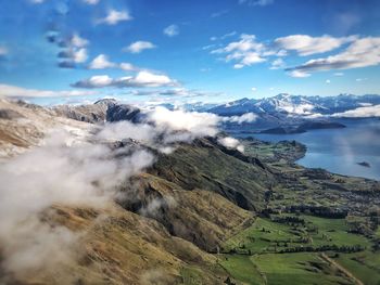 Aerial view of volcanic landscape against sky