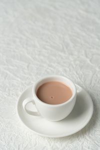 High angle view of coffee cup on table