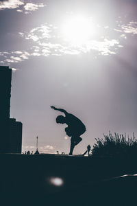 Silhouette of man against sky