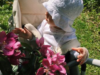 Midsection of woman holding bouquet