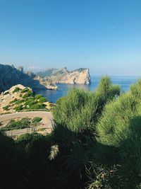 Scenic view of sea against clear blue sky