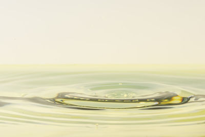 Close-up of splashing water against white background