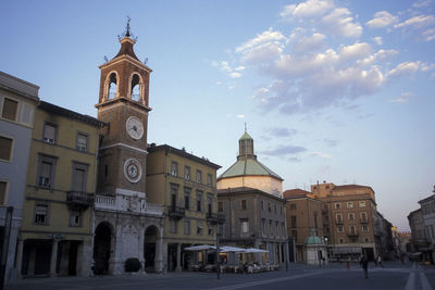 Street amidst buildings in city against sky