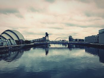 View of bridge in city against sky