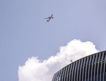 Low angle view of airplane flying in sky