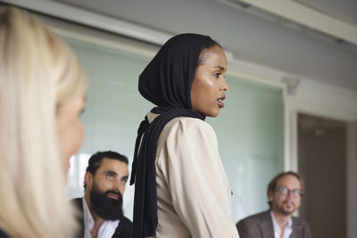 Smiling woman at business meeting