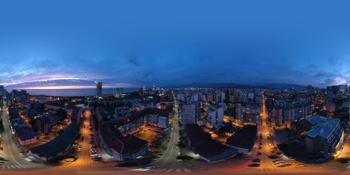 Illuminated buildings in city at night