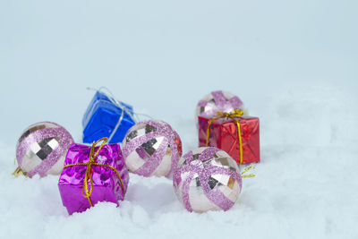 Close-up of christmas decorations against white background