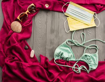 High angle view of personal accessories on bed