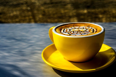 Close-up of coffee cup on table