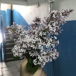 Cropped hand holding flower bouquet